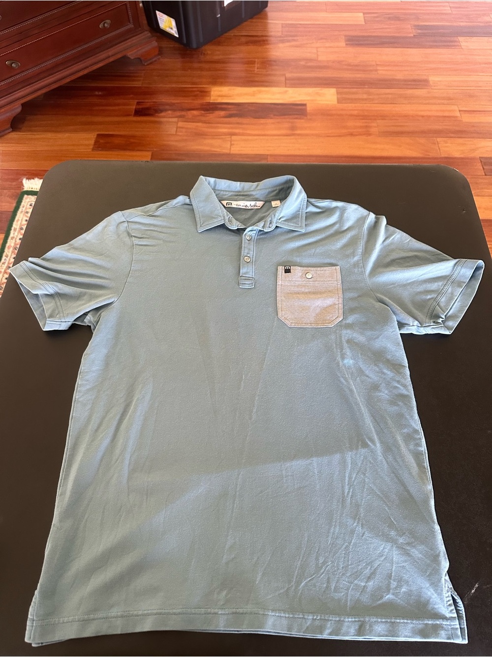 Travis Mathew Men's Light Blue Polo Shirt with Chest Pocket - Size Medium